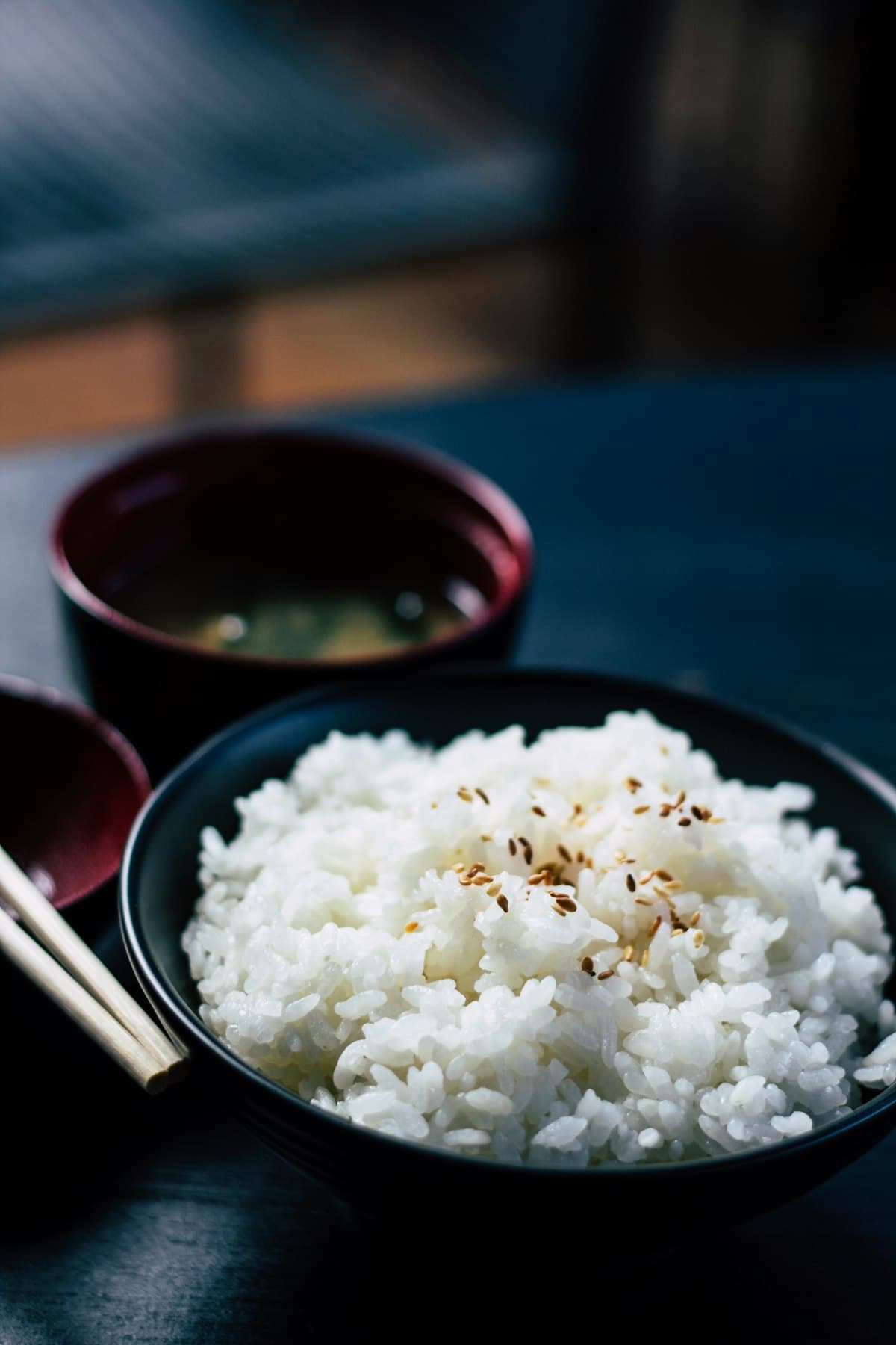 Brown rice and white rice side by side in bowls -- which is actually healthier?