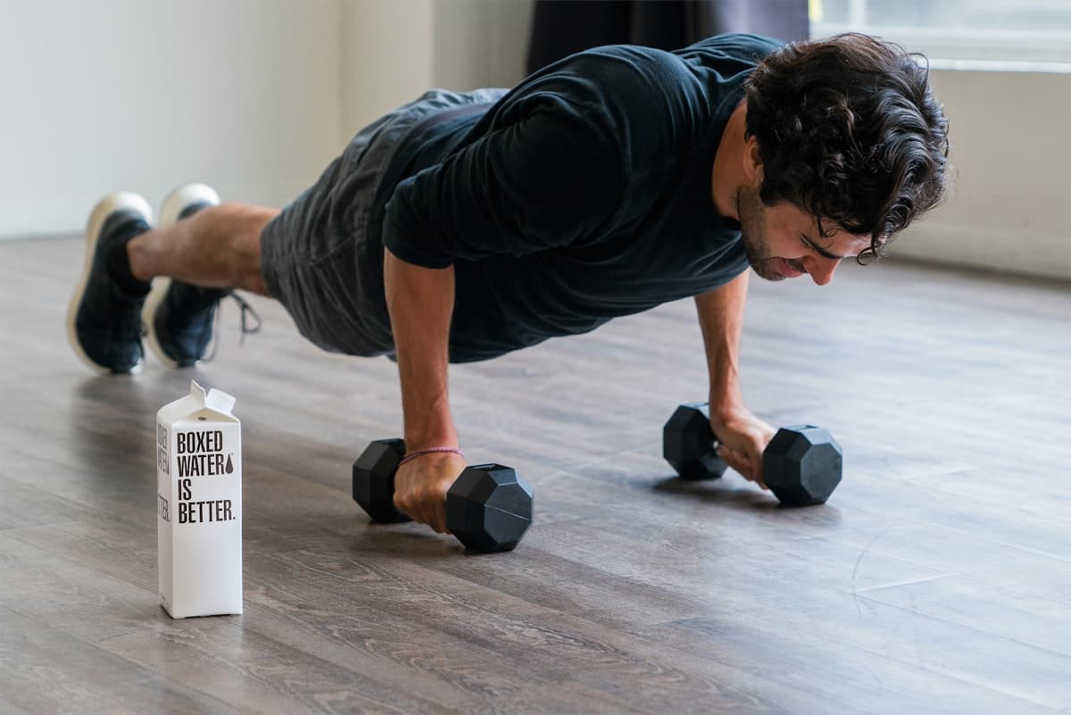 A shaker bottle holding a mix of collagen and creatine powder, illustrating stacking supplements