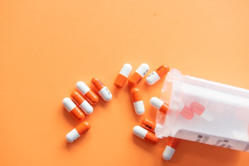 Various supplement capsules and pills arranged on a clean surface