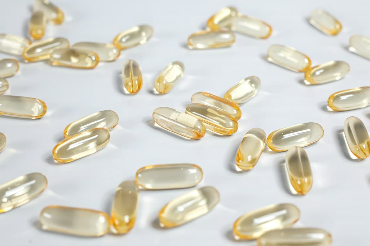 Neatly arranged supplement capsules, representing an NMN and resveratrol stack