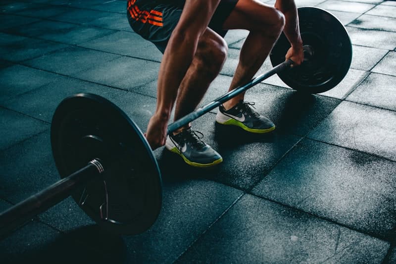 Fitness goals journal with protein shake and dumbbells — choosing the right protein for your goals