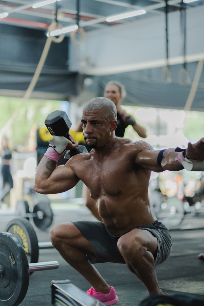 Person performing a squat with proper form -- targeting major muscle groups