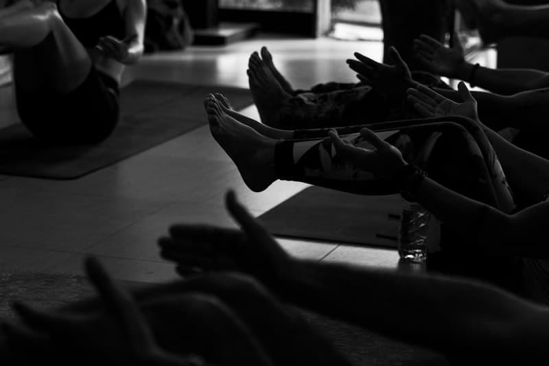 Person resting with legs elevated after a workout -- recovery best practices