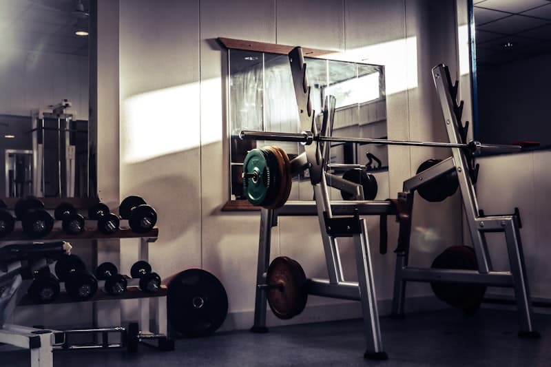 Barbell on a rack in a gym for resistance training