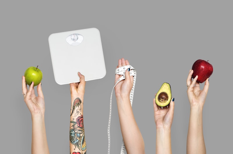 Hands holding fresh healthy food items — goal-based protein planning for weight loss and fitness